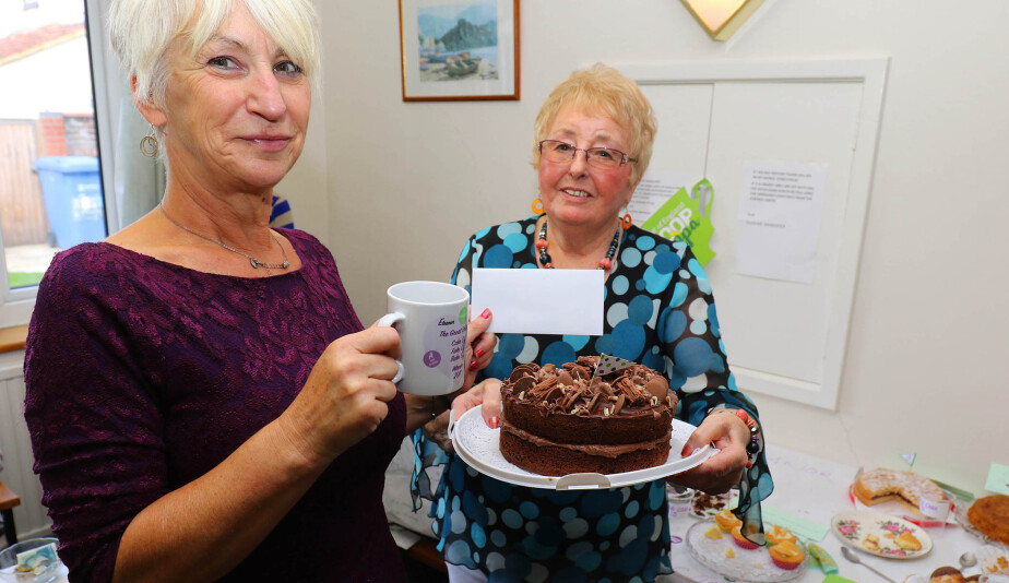 Norwich Housing Society scheme manager Sue Closs left with prizewinning baker Irene Young and her winning chocolate cake sm