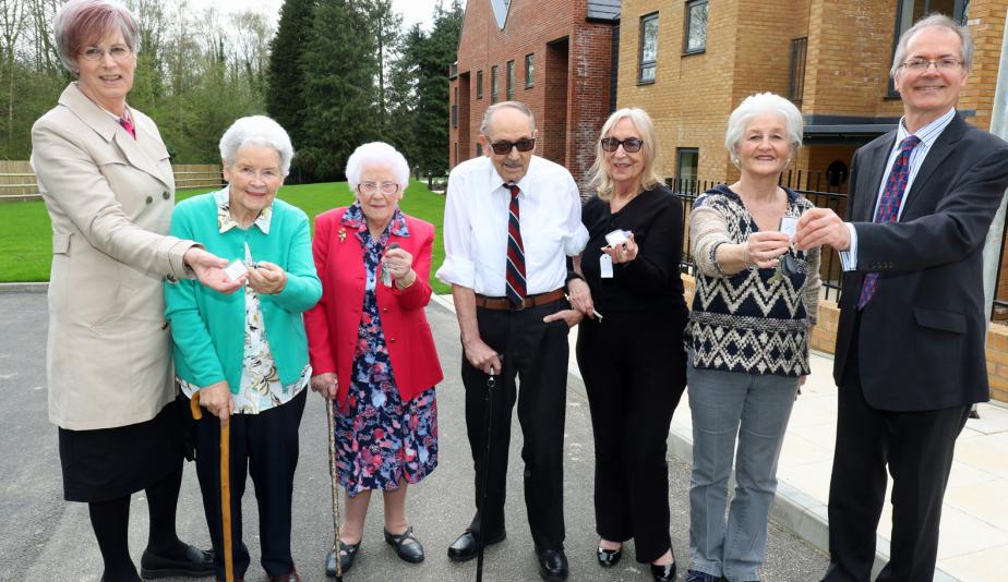 The first residents at Leander Court in Norwich receive their keys from Norwich Housing Society web