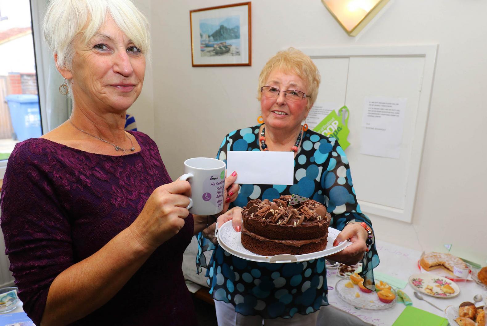 Norwich Housing Society scheme manager Sue Closs left with prizewinning baker Irene Young and her winning chocolate cake sm