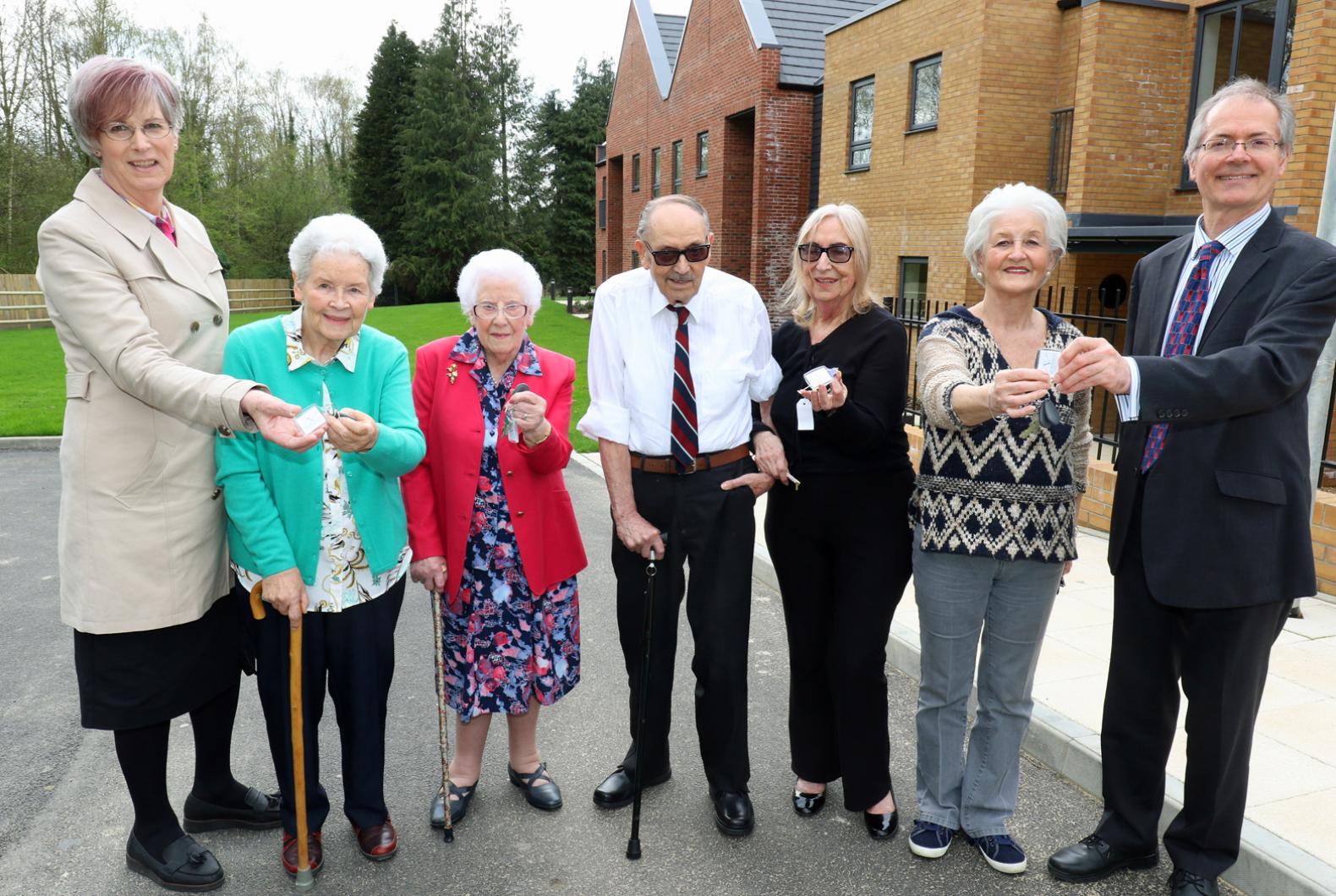 The first residents at Leander Court in Norwich receive their keys from Norwich Housing Society web