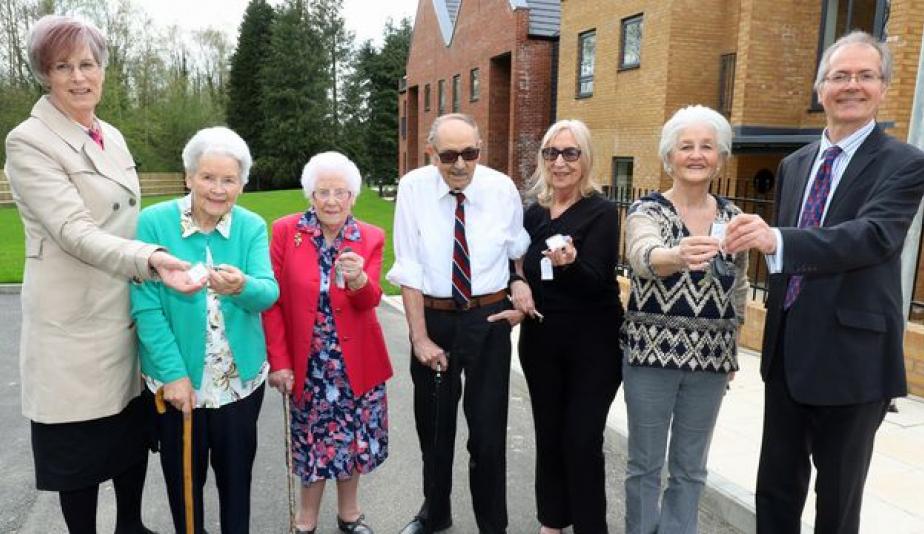 the first residents at leander court in norwich receive their keys from norwich housing society