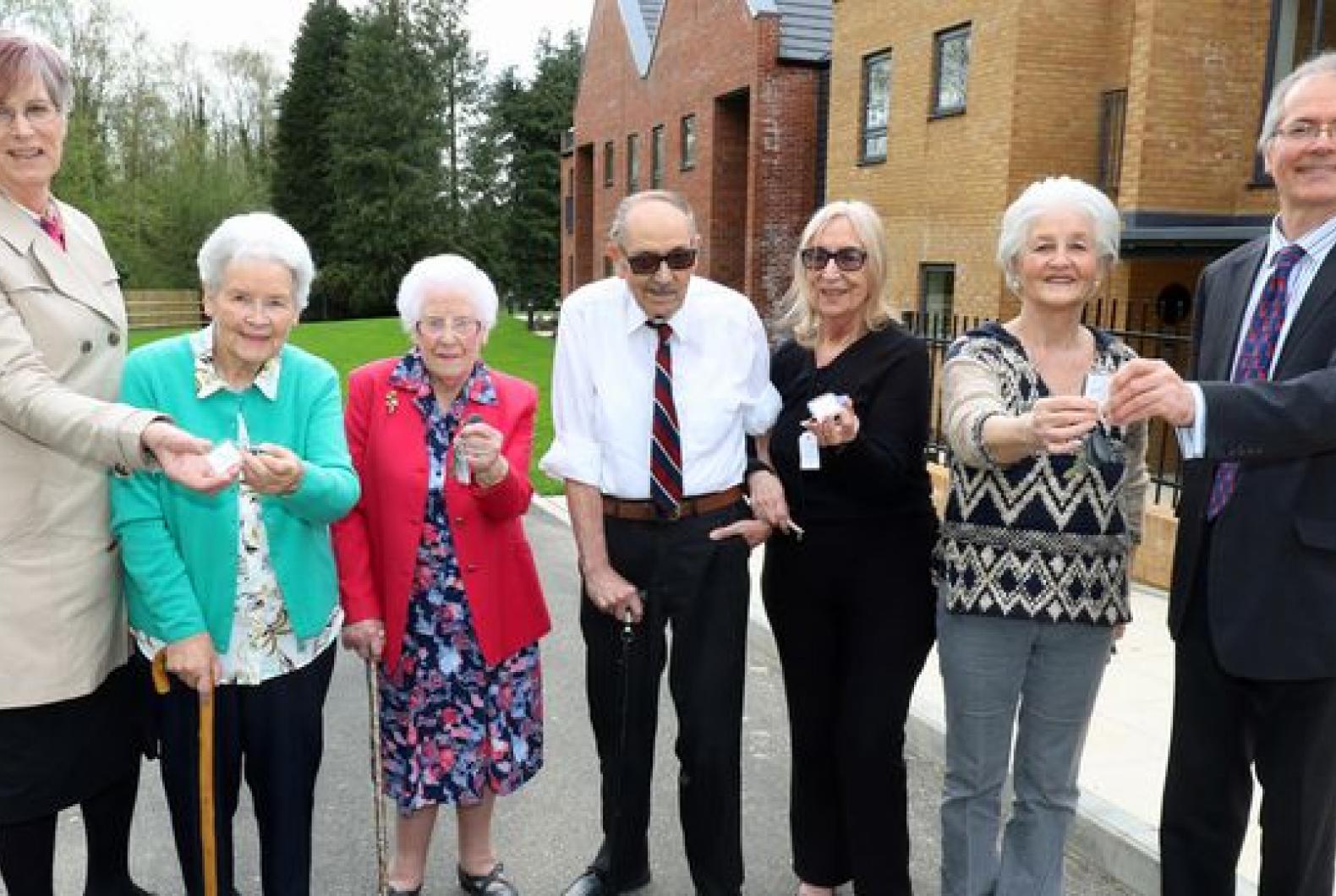 the first residents at leander court in norwich receive their keys from norwich housing society